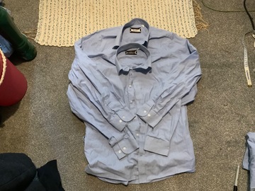 Selling with online payment: x2 Blue Shirts (Snr)